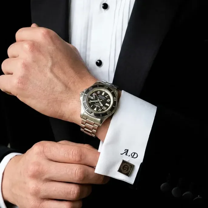 Monogrammed cufflink and tuxedo shirt detail